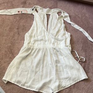 White shopow romper- never been worn size 08 but runs small